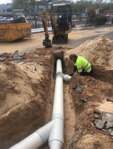 Plumber installing commercial storm water